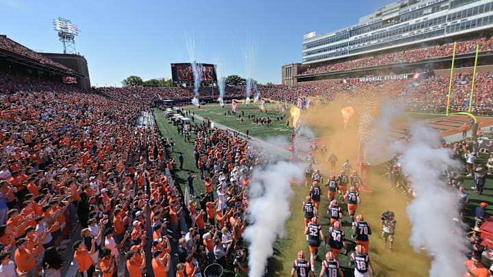 Sep 27, 2025; Champaign, Illinois, USA;  The Illinois Fighting Illini take the field before an NCAA football game with the Southern California Trojans  at Memorial Stadium. Mandatory Credit: Ron Johnson-Imagn Images
