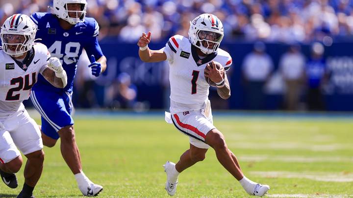 Sep 12, 2026; Provo, Utah, USA; Arizona Wildcats quarterback Noah Fifita (1) runs the ball against the BYU Cougars during the second quarter at LaVell Edwards Stadium. Sep 12, 2026; Provo, Utah, USA; Arizona Wildcats quarterback Noah Fifita (1) runs the ball against the BYU Cougars during the second quarter at LaVell Edwards Stadium.