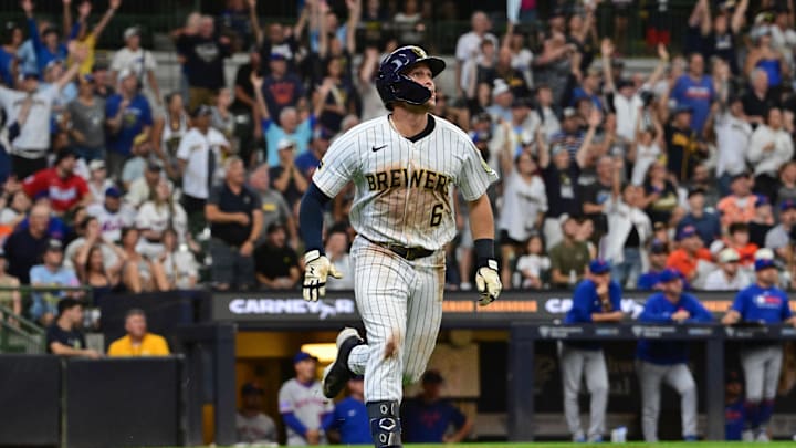 Aug 10, 2025; Milwaukee, Wisconsin, USA; Milwaukee Brewers left fielder Isaac Collins (6) watches his game-winning home run in the ninth inning against the New York Mets at American Family Field. Mandatory Credit: Benny Sieu-Imagn Images