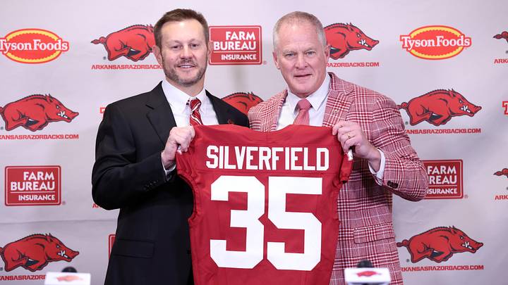 Dec 4, 2025; Fayetteville, AR, USA; Arkansas Razorbacks head coach Ryan Silverfield during his introductory press conference and vice chancellor and director of athletics Hunter Yurachek pose with a jersey with the number 35 signifying the 35th Arkansas head coach at Frank Broyles Center. Mandatory Credit: Nelson Chenault-Imagn Images Dec 4, 2025; Fayetteville, AR, USA; Arkansas Razorbacks head coach Ryan Silverfield during his introductory press conference and vice chancellor and director of athletics Hunter Yurachek pose with a jersey with the number 35 signifying the 35th Arkansas head coach at Frank Broyles Center. Mandatory Credit: Nelson Chenault-Imagn Images
