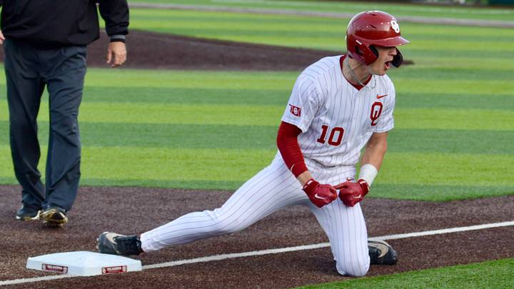 Oklahoma catcher/outfielder Brendan Brock celebrates after reaching base with a triple against Texas A&M.