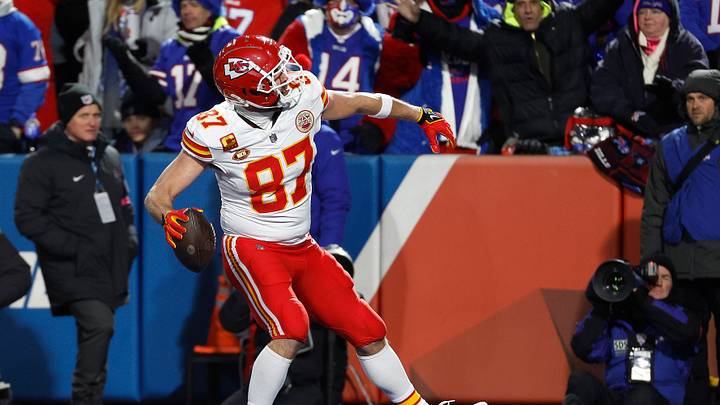 Kansas City Chiefs tight end Travis Kelce (87) throws the ball into the stands after scoring on a 22 yard touchdown catch.