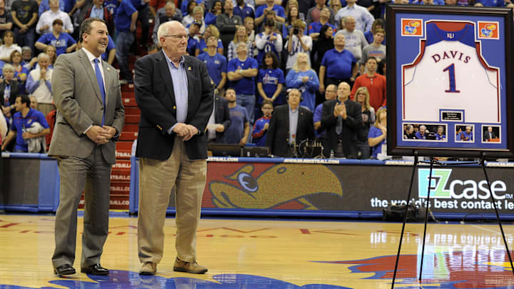 Mar 5, 2016; Lawrence, KS, USA; Kansas Jayhawks broadcaster Bob Davis is recognized by Athletic Director Sheahon Zenger during halftime of the game against the Iowa State Cyclones at Allen Fieldhouse. Davis is retiring. Kansas won the game 85-78. Mandatory Credit: John Rieger-Imagn Images