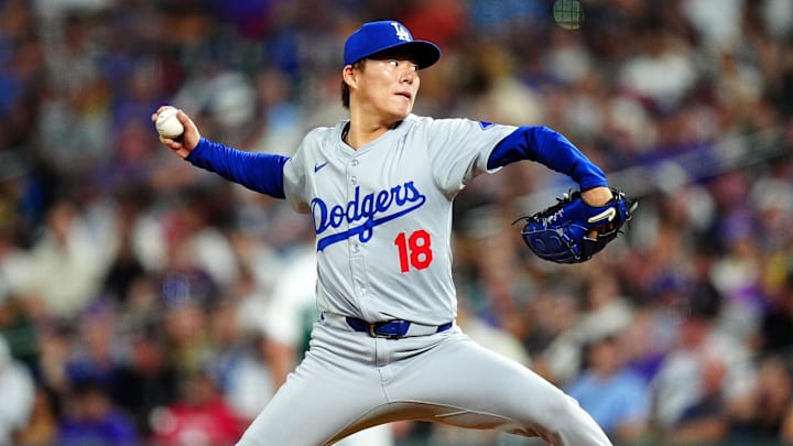 Los Angeles Dodgers starting pitcher Yoshinobu Yamamoto throws during a game against the Colorado Rockies on Sept. 28 at Coors Field.