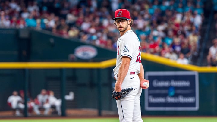 Aug 10, 2024; Phoenix, Arizona, USA; Arizona Diamondbacks pitcher Zac Gallen (23) looks back to first base while pitching in the first inning during a game against the Philadelphia Phillies at Chase Field. Mandatory Credit: Allan Henry-Imagn Images 