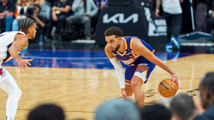 Nov 2, 2024; Phoenix, Arizona, USA;  Phoenix Suns guard Tyus Jones (21) brings the ball down the court in the second half during a game against the Portland Trail Blazers at Footprint Center. Mandatory Credit: Allan Henry-Imagn Images