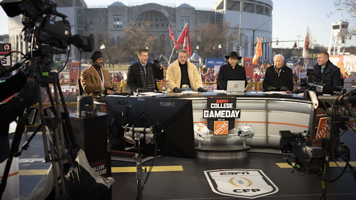 ESPN cast, from left, Desmond Howard, Rece Davis, Pat McAfee, Nick Saban, Lee Corso and Kirk Herbstreit sit on the set of College GameDay prior to the College Football Playoff first round game between the Ohio State Buckeyes and Tennessee Volunteers in Columbus on Dec. 21, 2024. ESPN cast, from left, Desmond Howard, Rece Davis, Pat McAfee, Nick Saban, Lee Corso and Kirk Herbstreit sit on the set of College GameDay prior to the College Football Playoff first round game between the Ohio State Buckeyes and Tennessee Volunteers in Columbus on Dec. 21, 2024.