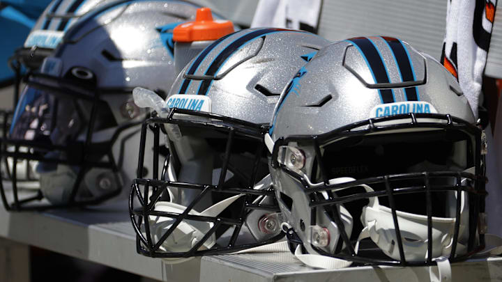 Aug 13, 2022; Landover, Maryland, USA; Carolina Panthers players helmets rest on the bench against the Washington Commanders at FedExField. Mandatory Credit: Geoff Burke-Imagn Images