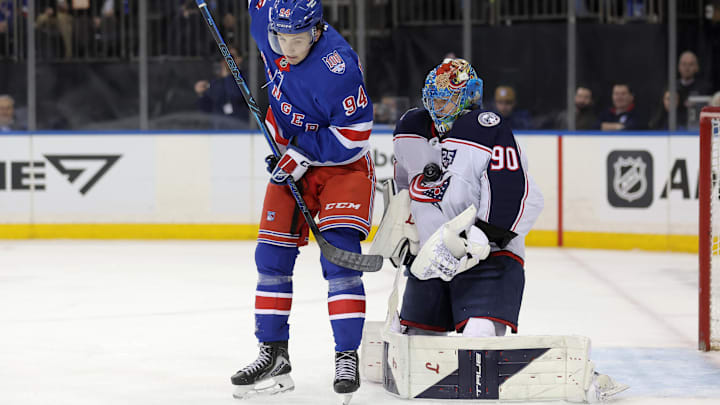 Mar 2, 2026; New York, New York, USA; Columbus Blue Jackets goaltender Elvis Merzlikins (90) makes a save in front of New York Rangers right wing Gabe Perreault (94) during the second period at Madison Square Garden. Mandatory Credit: Brad Penner-Imagn Images Mar 2, 2026; New York, New York, USA; Columbus Blue Jackets goaltender Elvis Merzlikins (90) makes a save in front of New York Rangers right wing Gabe Perreault (94) during the second period at Madison Square Garden. Mandatory Credit: Brad Penner-Imagn Images