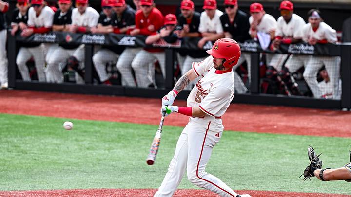 Louisville baseball outfielder Lucas Moore puts a ball into play.