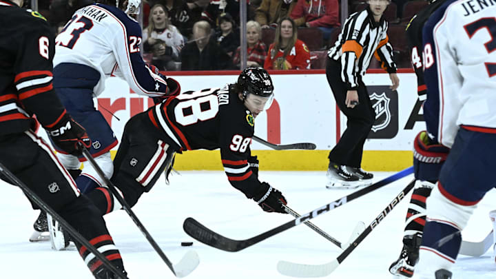 Jan 30, 2026; Chicago, Illinois, USA; Columbus Blue Jackets center Sean Monahan (23) knocks Chicago Blackhawks center Connor Bedard (98) to the ice during the first period at the United Center. Mandatory Credit: Matt Marton-Imagn Images Jan 30, 2026; Chicago, Illinois, USA; Columbus Blue Jackets center Sean Monahan (23) knocks Chicago Blackhawks center Connor Bedard (98) to the ice during the first period at the United Center. Mandatory Credit: Matt Marton-Imagn Images