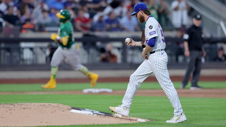 Aug 13, 2024; New York City, New York, USA; New York Mets starting pitcher Paul Blackburn (58) reacts after giving up a three run home run to Oakland Athletics catcher Shea Langeliers (23) during the third inning at Citi Field. Mandatory Credit: Brad Penner-USA TODAY Sports Aug 13, 2024; New York City, New York, USA; New York Mets starting pitcher Paul Blackburn (58) reacts after giving up a three run home run to Oakland Athletics catcher Shea Langeliers (23) during the third inning at Citi Field. Mandatory Credit: Brad Penner-USA TODAY Sports