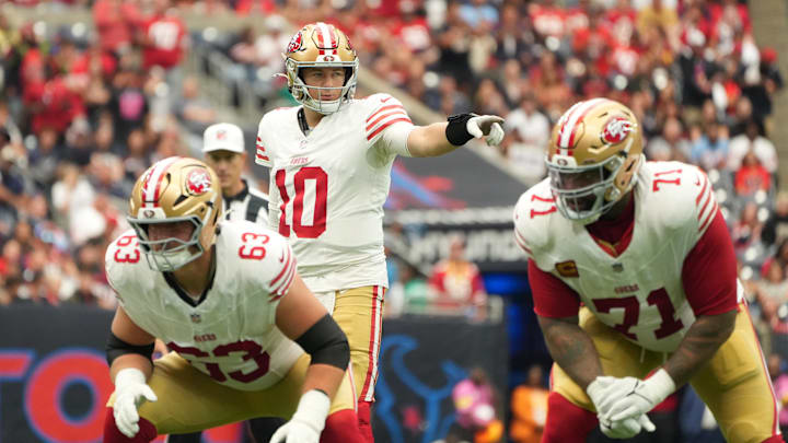 Oct 26, 2025; Houston, Texas, USA; San Francisco 49ers quarterback Mac Jones (10) directs a play during the second quarter against the Houston Texans at NRG Stadium. Mandatory Credit: Sean Thomas-Imagn Images