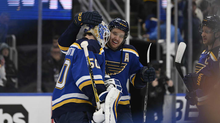 Apr 27, 2025; St. Louis, Missouri, USA; St. Louis Blues center Robert Thomas (18) and goaltender Jordan Binnington (50) celebrate defeating the Winnipeg Jets in game four of the first round of the 2025 Stanley Cup Playoffs at Enterprise Center. Mandatory Credit: Jeff Le-Imagn Images Apr 27, 2025; St. Louis, Missouri, USA; St. Louis Blues center Robert Thomas (18) and goaltender Jordan Binnington (50) celebrate defeating the Winnipeg Jets in game four of the first round of the 2025 Stanley Cup Playoffs at Enterprise Center. Mandatory Credit: Jeff Le-Imagn Images
