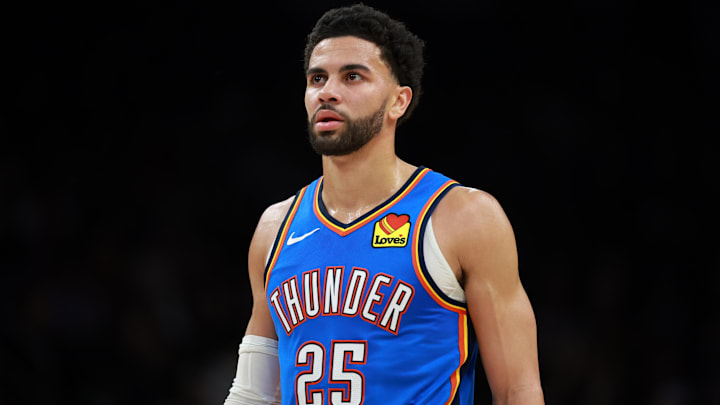 Jan 4, 2026; Phoenix, Arizona, USA; Oklahoma City Thunder guard Ajay Mitchell (25) against the Phoenix Suns at Mortgage Matchup Center. Mandatory Credit: Mark J. Rebilas-Imagn Images