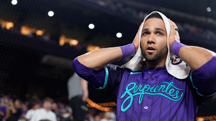 Aug 22, 2025; Phoenix, Arizona, USA; Arizona Diamondbacks outfielder Lourdes Gurriel Jr. (12) reacts after hitting the game winning RBI in the eleventh inning against the Cincinnati Reds at Chase Field to beat the reads 6-5. Mandatory Credit: Allan Henry-Imagn Images