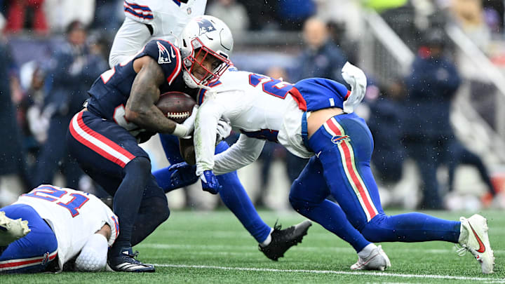 Dec 14, 2025; Foxborough, Massachusetts, USA; Buffalo Bills safety Cole Bishop (24) tackles New England Patriots running back Treveyon Henderson (32) at Gillette Stadium. Dec 14, 2025; Foxborough, Massachusetts, USA; Buffalo Bills safety Cole Bishop (24) tackles New England Patriots running back Treveyon Henderson (32) at Gillette Stadium.