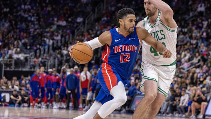 Oct 26, 2024; Detroit, Michigan, USA; Boston Celtics center Luke Kornet (40) defends against Detroit Pistons forward Tobias Harris (12) during the second half at Little Caesars Arena. Mandatory Credit: David Reginek-Imagn Images