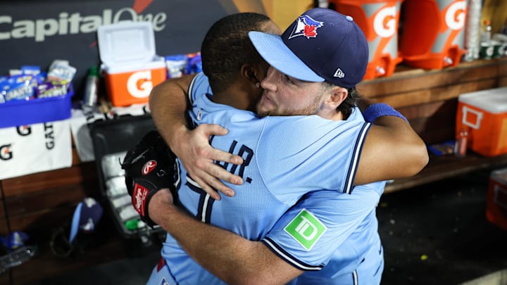 Toronto Blue Jays pitcher Trey Yesavage (39) hugs Toronto Blue Jays first baseman Vladimir Guerrero Jr. (27) after the game against the Los Angeles Dodgers during game five of the 2025 MLB World Series at Dodger Stadium.