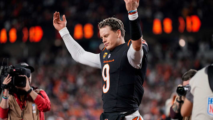 Cincinnati Bengals quarterback Joe Burrow (9) celebrates after the game-winning touchdown pass to Tee Higgins in overtime of the NFL Week 17 game between the Cincinnati Bengals and the Denver Broncos at Paycor Stadium in downtown Cincinnati on Saturday, Dec. 28, 2024. The Bengals took a 30-24 win in overtime to remain in the post season chase.