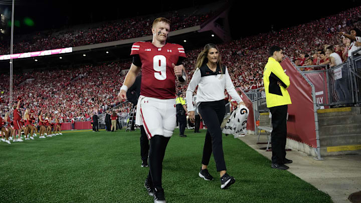 Aug 28, 2025; Madison, Wisconsin, USA;  Wisconsin Badgers quarterback Billy Edwards Jr. (9) walks to the locker room after being injured during the second quarter against the Miami (OH) RedHawks at Camp Randall Stadium. Mandatory Credit: Jeff Hanisch-Imagn Images