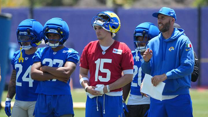 Jun 2, 2026; Woodland Hills, CA, USA; Los Angeles Rams running backs Blake Corum (24), Jarquez Hunter (27), quarterback Ty Simpson (15) and quarterbacks coach Dave Ragone watch during organized team activities at Rams Practice Facility. Mandatory Credit: Kirby Lee-Imagn Images Jun 2, 2026; Woodland Hills, CA, USA; Los Angeles Rams running backs Blake Corum (24), Jarquez Hunter (27), quarterback Ty Simpson (15) and quarterbacks coach Dave Ragone watch during organized team activities at Rams Practice Facility. Mandatory Credit: Kirby Lee-Imagn Images
