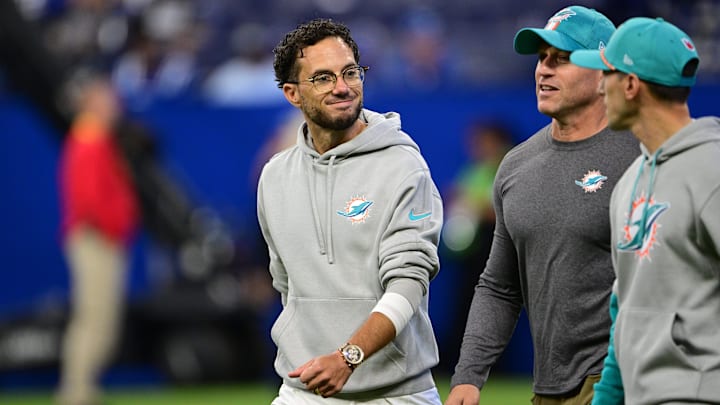 Miami Dolphins Head Coach Mike McDaniel talk with coaching staff while entering the field before the game against the Indianapolis Colts at Lucas Oil Stadium.