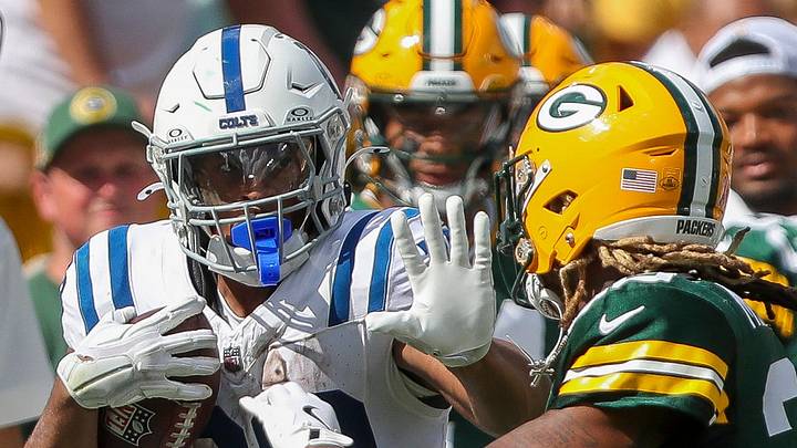 Indianapolis Colts running back Jonathan Taylor (28) stiff-arms Green Bay Packers safety Xavier McKinney in 2024. Indianapolis Colts running back Jonathan Taylor (28) stiff-arms Green Bay Packers safety Xavier McKinney in 2024.