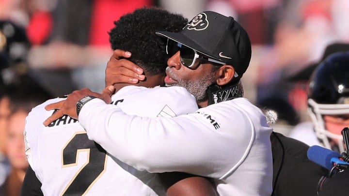 Colorado football coach Deion Sanders hugs his son, Shedeur Sanders, before facing Texas Tech in a Big 12 football game Saturday, Nov. 9, 2024, at Jones AT&T Stadium. Colorado football coach Deion Sanders hugs his son, Shedeur Sanders, before facing Texas Tech in a Big 12 football game Saturday, Nov. 9, 2024, at Jones AT&T Stadium.