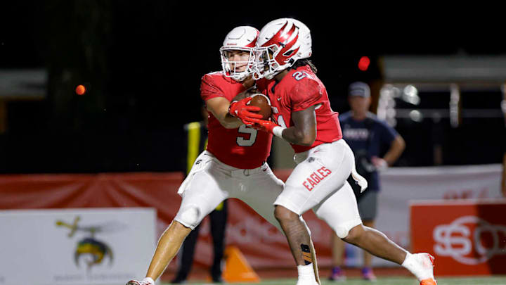 Milton running back TJ Lester (21) added 143 yards and two touchdowns to his 2024 rushing totals last Friday. He is a candidate for this week's North Georgia high school football Player of the Week.