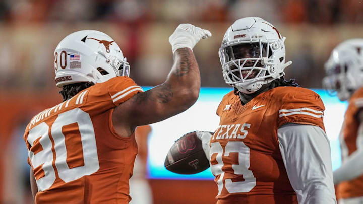 Texas Longhorns defensive lineman T'Vondre Sweat (93) and Texas Longhorns defensive lineman Byron Murphy
