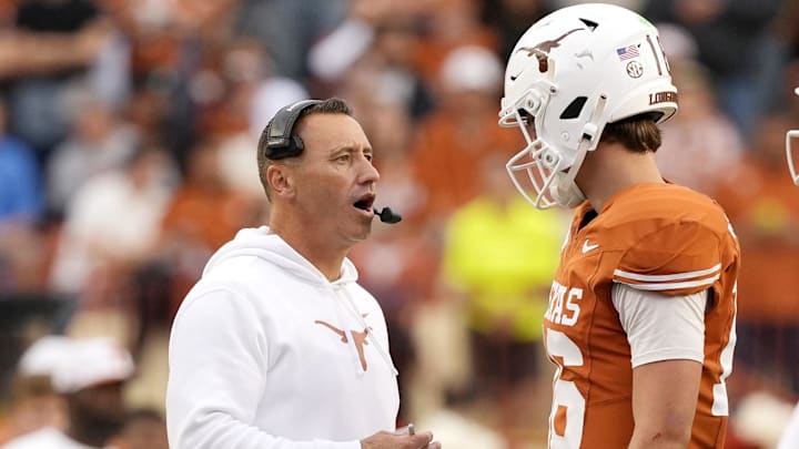 Texas Longhorns head coach Steve Sarkisian talks with quarterback Arch Manning during a timeout in the second half against the Vanderbilt Commodores at Darrell K Royal-Texas Memorial Stadium. 