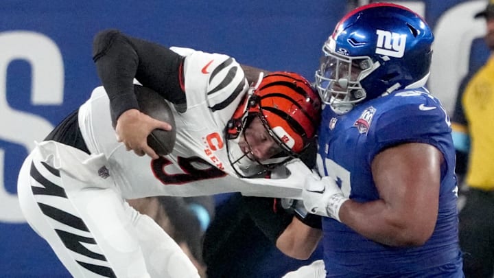 Oct 13, 2024; East Rutherford, New Jersey, USA; Cincinnati Bengals quarterback Joe Burrow (9) is sacked by New York Giants defensive tackle Dexter Lawrence II (97) in the 3rd quarter at MetLife Stadium. Mandatory Credit: Robert Deutsch-Imagn Images Oct 13, 2024; East Rutherford, New Jersey, USA; Cincinnati Bengals quarterback Joe Burrow (9) is sacked by New York Giants defensive tackle Dexter Lawrence II (97) in the 3rd quarter at MetLife Stadium. Mandatory Credit: Robert Deutsch-Imagn Images