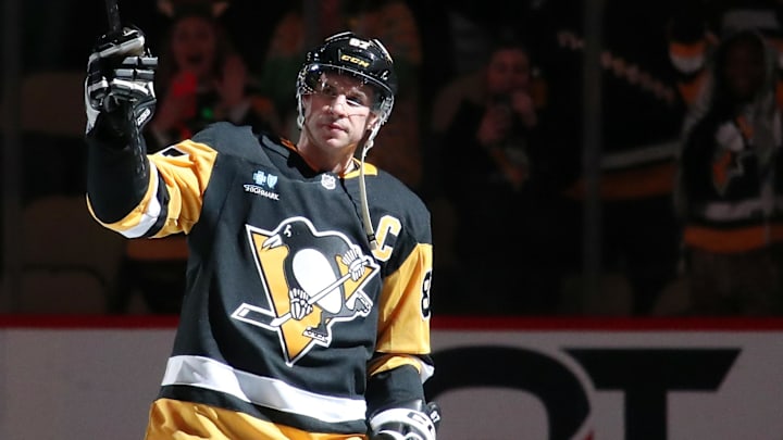 Dec 23, 2024; Pittsburgh, Pennsylvania, USA;  Pittsburgh Penguins center Sidney Crosby (87) reacts to being named first star of the game against the Philadelphia Flyers at PPG Paints Arena. Mandatory Credit: Charles LeClaire-Imagn Images