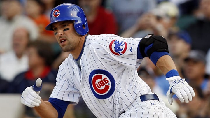 Sep 18, 2008; Chicago, IL, USA; Chicago Cubs second baseman Mark DeRosa (7) hits a single during the 11th inning against the Milwaukee Brewers at Wrigley Field. 