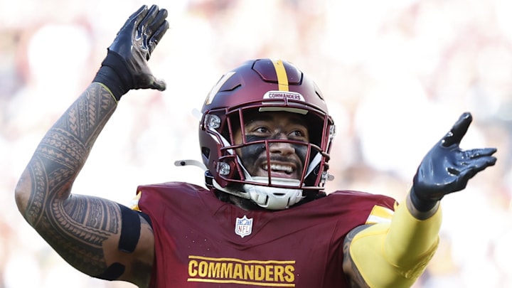Nov 24, 2024; Landover, Maryland, USA; Washington Commanders linebacker Frankie Luvu (4) celebrates after making a play Dallas Cowboys during the second quarter at Northwest Stadium. Mandatory Credit: Geoff Burke-Imagn Images