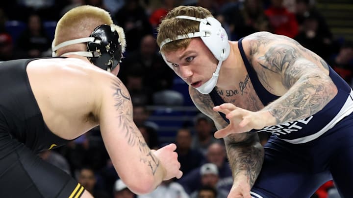 Mar 7, 2026; University Park, PA, USA; Penn State’s Rocco Welsh (right) wrestles Iowa’s Angelo Ferrari (left) in a 184-pound bout during the quarterfinals of the Big Ten Wrestling Championships at Bryce Jordan Center. Mandatory Credit: Matthew O'Haren-Imagn Images