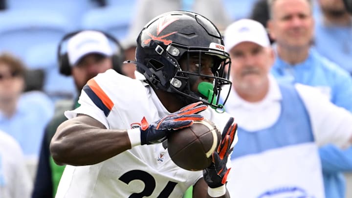 Oct 25, 2025; Chapel Hill, North Carolina, USA; Virginia Cavaliers running back Harrison Waylee (21) with the ball in the third quarter at Kenan Stadium. Mandatory Credit: Bob Donnan-Imagn Images
