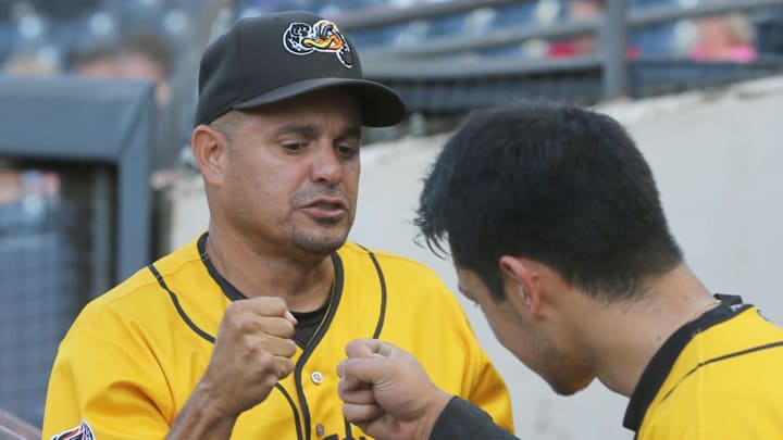 RubberDucks hitting coach Junior Betances fist bumps Steven Kwan before the start of the game against Harrisburg on Aug. 18, 2021, in Akron, Ohio.