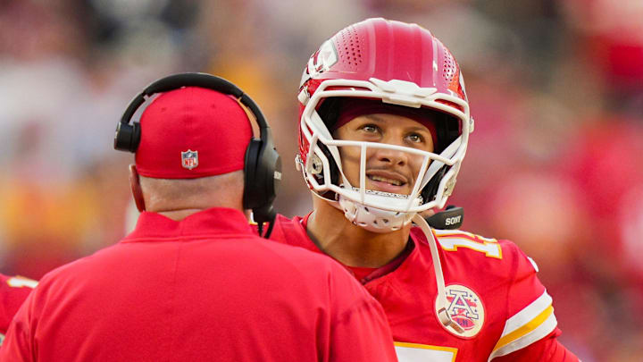 Sep 28, 2025; Kansas City, Missouri, USA; Kansas City Chiefs quarterback Patrick Mahomes (15) talks with head coach Andy Reid during the second half against the Baltimore Ravens at GEHA Field at Arrowhead Stadium. Mandatory Credit: Jay Biggerstaff-Imagn Images