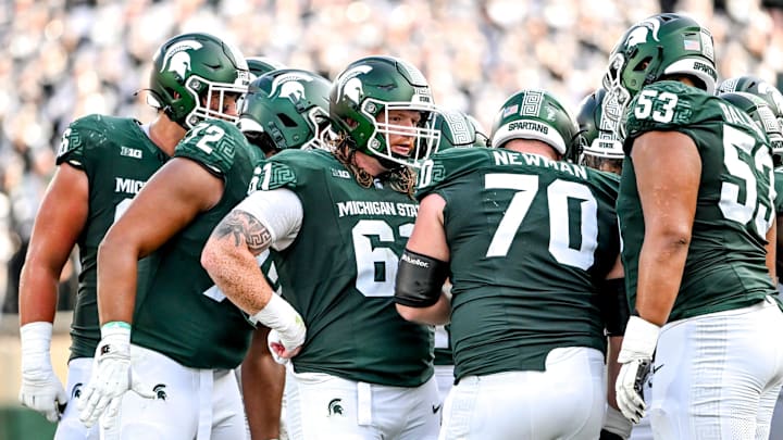 Michigan State's offensive line, from left, Ashton Lepo, Dallas Fincher, Tanner Miller, Luke Newman and Brandon Baldwin huddle up during the fourth quarter in the game against Prairie View A&M on Saturday, Sept. 14, 2024, at Spartan Stadium in East Lansing.