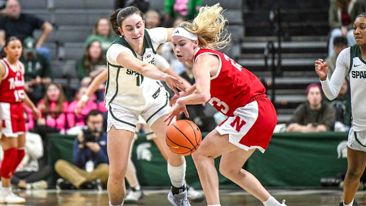 Michigan State's InŽs Sotelo pressures Nebraska's Britt Prince.