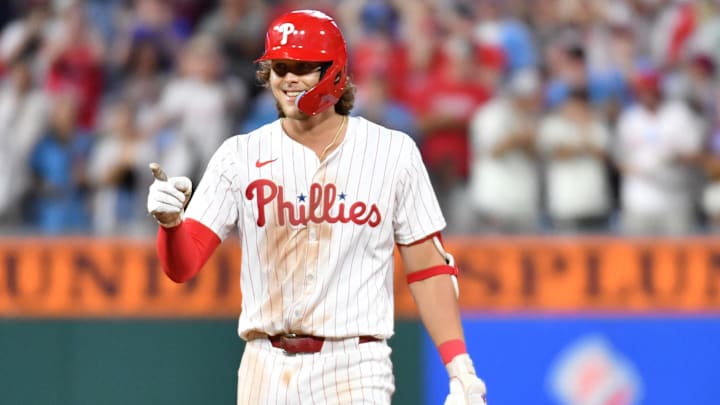 May 22, 2024; Philadelphia, Pennsylvania, USA; Philadelphia Phillies third base Alec Bohm (28) reacts after hitting a two RBI double during the sixth inning against the Texas Rangers at Citizens Bank Park.
