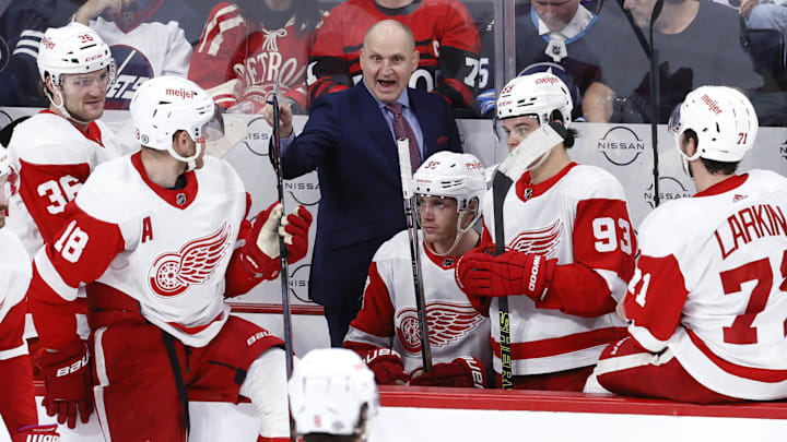 Detroit Red Wings head coach Derek Lalonde gestures to the referee during a stoppage in play.