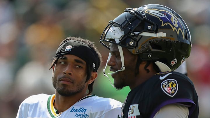 Green Bay Packers cornerback talks with Baltimore Ravens quarterback and former University of Louisville teammate Lamar Jackson (8) during a joint practice on Thursday, August 22, 2024, at Ray Nitschke Field in Ashwaubenon, Wis. 
Tork Mason/USA TODAY NETWORK-Wisconsin