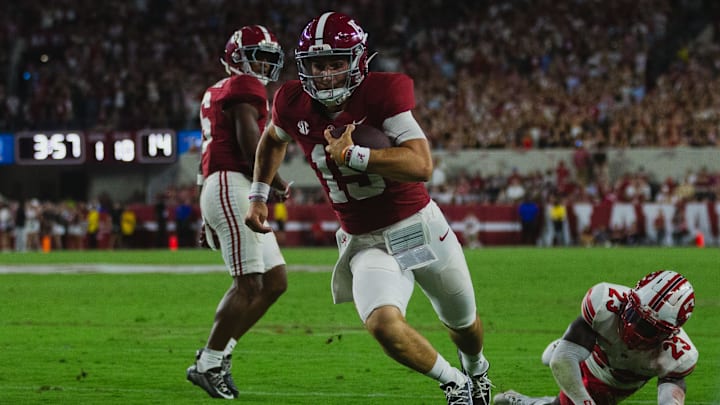 Aug 31, 2024; Tuscaloosa, Alabama, USA; Western Kentucky Hilltoppers defensive back Keyshawn Swanson (23) dives for Alabama Crimson Tide quarterback Ty Simpson (15) as he approaches the end zone during the third quarter at Bryant-Denny Stadium. Mandatory Credit: Will McLelland-Imagn Images