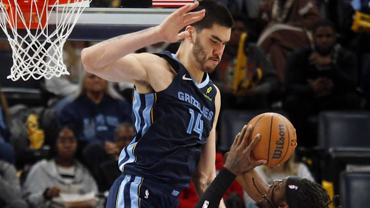 Dec 7, 2025; Memphis, Tennessee, USA; Portland Trail Blazers forward Jerami Grant (9) shoots as Memphis Grizzlies center Zach Edey (14) defends during the third quarter at FedExForum. Mandatory Credit: Petre Thomas-Imagn Images