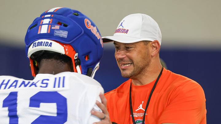 Florida head coach Jon Sumrall talks with Florida cornerback Ben Hanks II (12) during practice during spring practice at Sanders Practice Fields in Gainesville, FL on Thursday, April 2, 2026. [Alan Youngblood/Gainesville Sun]