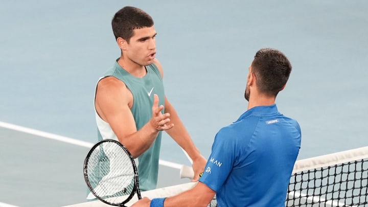 Novak Djokovic of Serbia shakes hands after defeating third seed Carlos Alcaraz of Spain on Rod Laver Arena in the Quarterfinals match on day 11 of the 2025 Australian Open in Melbourne, Australia. 