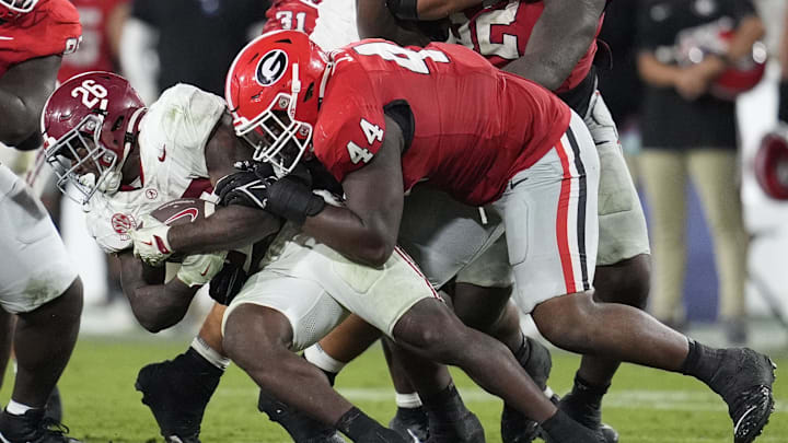 Sep 27, 2025; Athens, Georgia, USA; Georgia Bulldogs defensive lineman Jordan Hall (44) tackles Alabama Crimson Tide running back Jam Miller (26) in the fourth quarter at Sanford Stadium. Mandatory Credit: Dale Zanine-Imagn Images